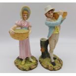 Pair of Royal Worcester porcelain figural spill vases, a boy fruit picker and his partner, 24cm high