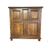 Substantial continental oak panelled housekeepers cupboard, fitted with four doors with shelved