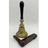 Large ebonised handle brass hand or school bell, 42cm long with further treen crow scarer or