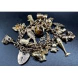 9ct charm bracelet with heart padlock clasp, with twenty charms to include hinged lady who lived