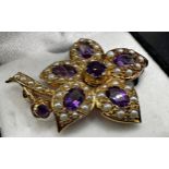 Good quality cast 9ct flower brooch, set with amethyst and seed pearl, 4cm high, 8.6g