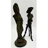 Good pair of French novelty spelter candlesticks in the form of a humorous cowboy and his partner,