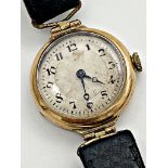 1930s 9ct dress watch, 25mm case, silvered dial, Arabic numerals, hinged lugs and leather strap,