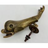 Antique cast brass dolphin door knocker, 30cm long