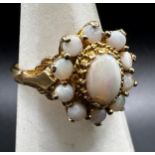 Good quality 9ct opal cluster ring, .75ct central stone, size P, Maker EKRJ, 3.5g