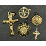 Five 9ct pendants - crucifix 4cm long, Maimillano coin, St Christopher and two others, 6g