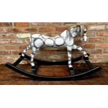 Early 20th century papier mache dapple grey rocking horse, with horsehair and ebonised base, 106cm