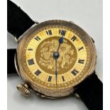 J.B Dent & Sons 10ct gold watch with Roman numerals, floral etching to face, surrounding case etched