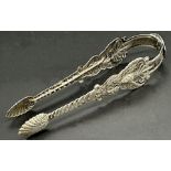 Pair of highly decorative continental white metal sugar tongs, 14.5cm long