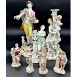 A collection of Dresden porcelain figures to include a gentleman flower picker with a dog at his