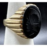 9ct intaglio ring, the stone carve with a soldier, size S/T, 6.9g gross