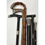 Four ebonised silver applied walking canes to include a Sunday stick with further Sunday stick and