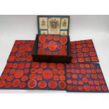 Antique fabric applied box containing six tiers of various wax seals