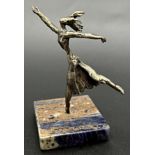 Interesting white metal female figure, signed Werth?, on a blue stone base, 10cm high