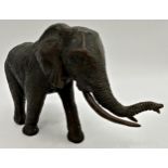 Good quality cast bronze study of a standing elephant, 28cm long