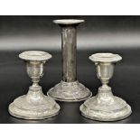 Pair of Edwardian silver dwarf candlesticks with a further silver candlestick (3)