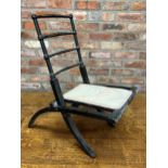 Probably by E W Godwin, ebonised folding chair, with gilt highlights, 70cm high