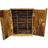 Well made exotic wood coin specimen cabinet, twin doors enclosing nineteen drawers with segmented