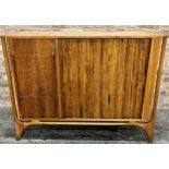 Good quality 1960s teak drinks cabinet, with tambour slide door, four graduated drawers and