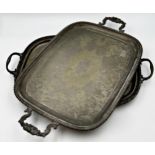 Two similar antique cast Sheffield plate twin handled trays, the largest 65cm long