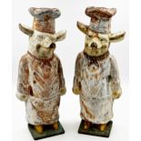 Good pair of antique cast iron butcher shop pigs, dressed in chef whites, original painted