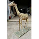 Good 19th century Toleware giraffe, with original painted polychrome decoration on green square