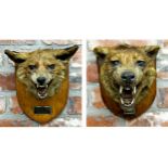 Taxidermy - probably by Roland Ward - two fox masks on oak plaques by Army & Navy Stores, each