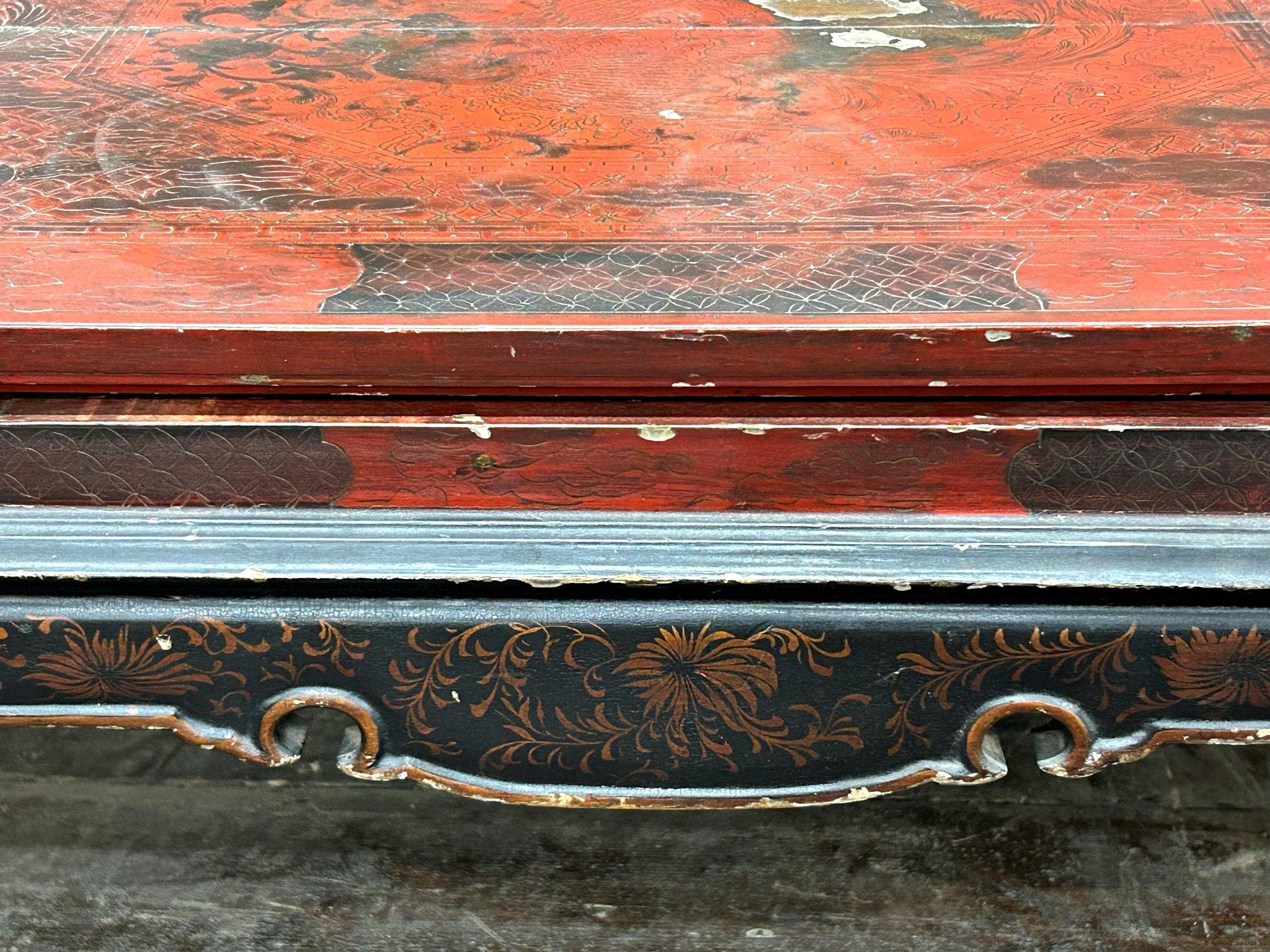 Antique Chinese red lacquered coffee table, decorated with dragons and griffins, 33cm high x 97cm - Image 2 of 3