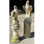 Graduated pair of reconstituted stone eagles on Corinthian column plinths, the largest 110cm (2)