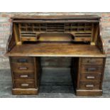 Early 20th century oak twin pedestal roll top desk, pigeonhole interior, two banks of four