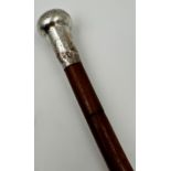 A late 19th/early 20th century, silver knopped bamboo swagger stick, marks rubbed, of tapering form,