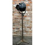 Strand theatre lamp upon a Seecol cast iron stand, 145cm high