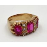 9ct pink ruby and white stone cluster ring, the central stone 1ct, size N, 7.4g