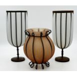 Pair of iron framed lobed glass vases or storm lanterns, 35.5cm high with a further similar