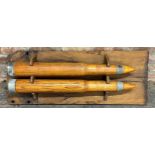 Pair of 1944 Naval Oak Dummy Cartridges for Training, mounted to a bespoke fruitwood plaque, 105 x