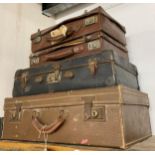 Four leather suitcases