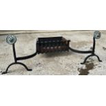 Regency cast iron fire basket with attached andirons with brass lion head finials. Width 119cm x