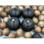 Large collection of treen fruitwood balls, each 7cm diameter approx, with four lawn bowls
