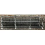 A matched pair of chrome and steel vintage railway carriage two tier luggage racks, 190cm long