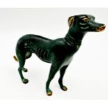 Patinated bronze of a standing Greyhound, 14cm high x 17cm long