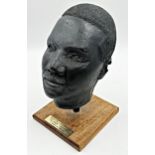 20th century school - plaster study of the head of Martin Luther King, raised on a wooded plinth