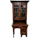 Liberty and co - Exceptional Arts and Crafts oak desk bookcase, the raise back carved 'By Nature