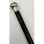 A George V, ebonised silver knopped swagger stick, JP, London 1923, of tapering form 92cm