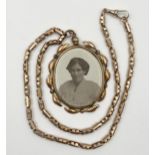 9ct fancy gate link chain, 40cm long approx, 8.6g, with a further gold framed twin photograph