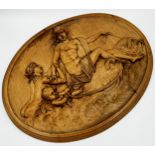 Good quality 19th century carved oval fruitwood panel, with classical scene of nudes riding a fish