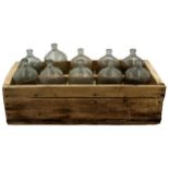 Vintage Industrial ten glass demi john bottle cruet, in rustic twin handled frame, 66cm long