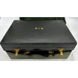 Exceptional quality Edwardian racing green leather vanity case, with canvas protector, enclosing