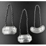 Three silver decanter labels for Port, Sherry and Madeira, various dates and makers, largest 4cm