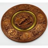 Good heavy copper and brass repousse charger, centrally decorated with a cavalier, framed by further