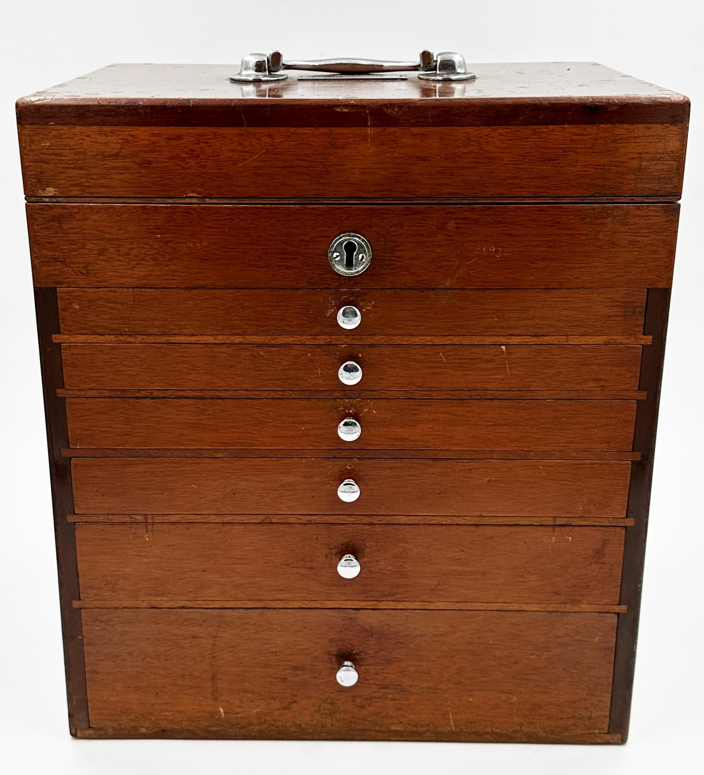 Vintage teak cased travelling dentist cabinet by The S S White Co of London, hinged lid with six